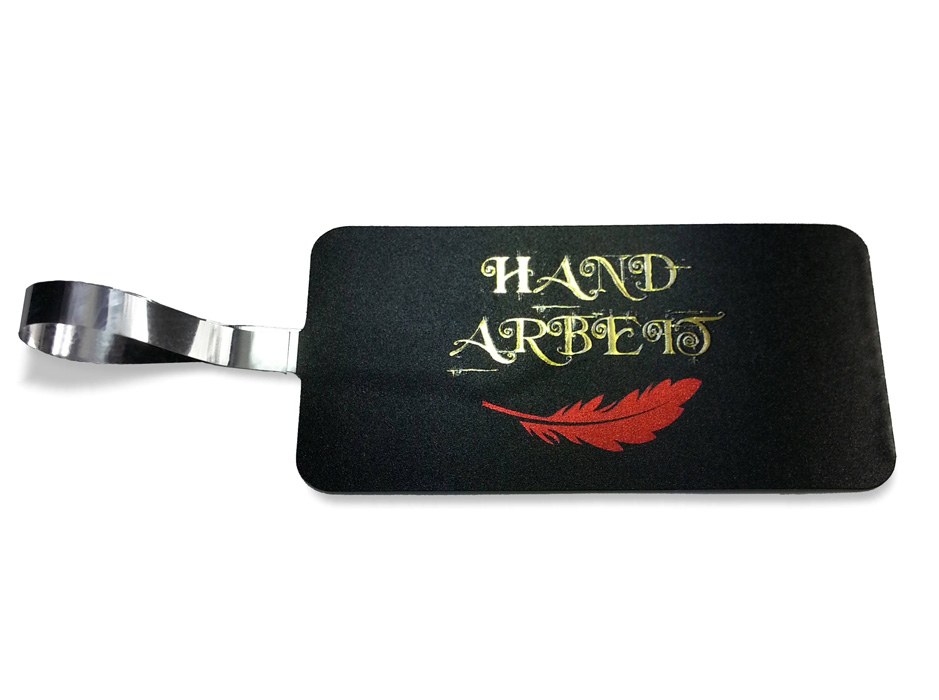 Artistic jewellery tag, golden letter on black, red feather